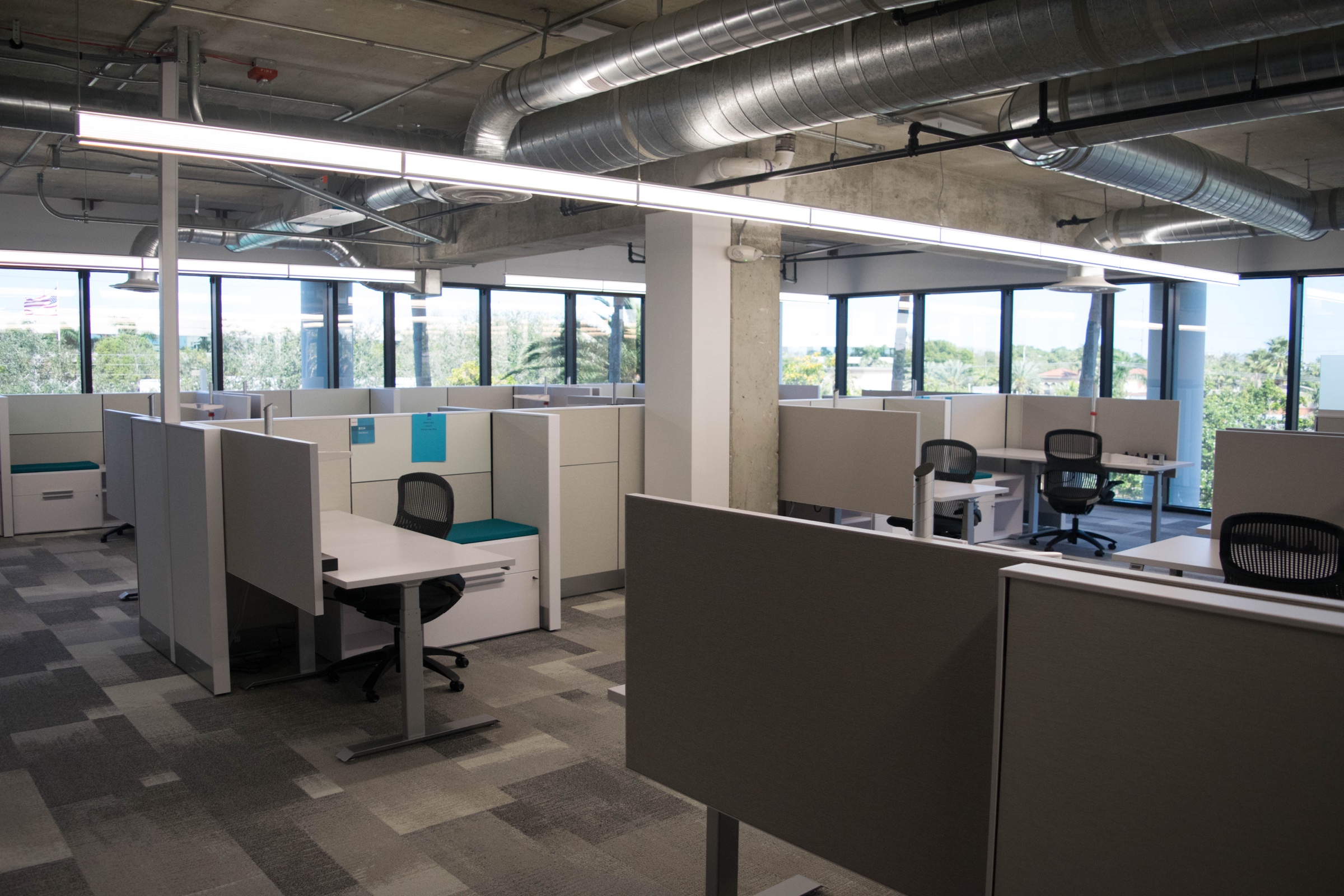 Open-deck office with spiral ductwork at Deluxe Corporation, Boca Raton