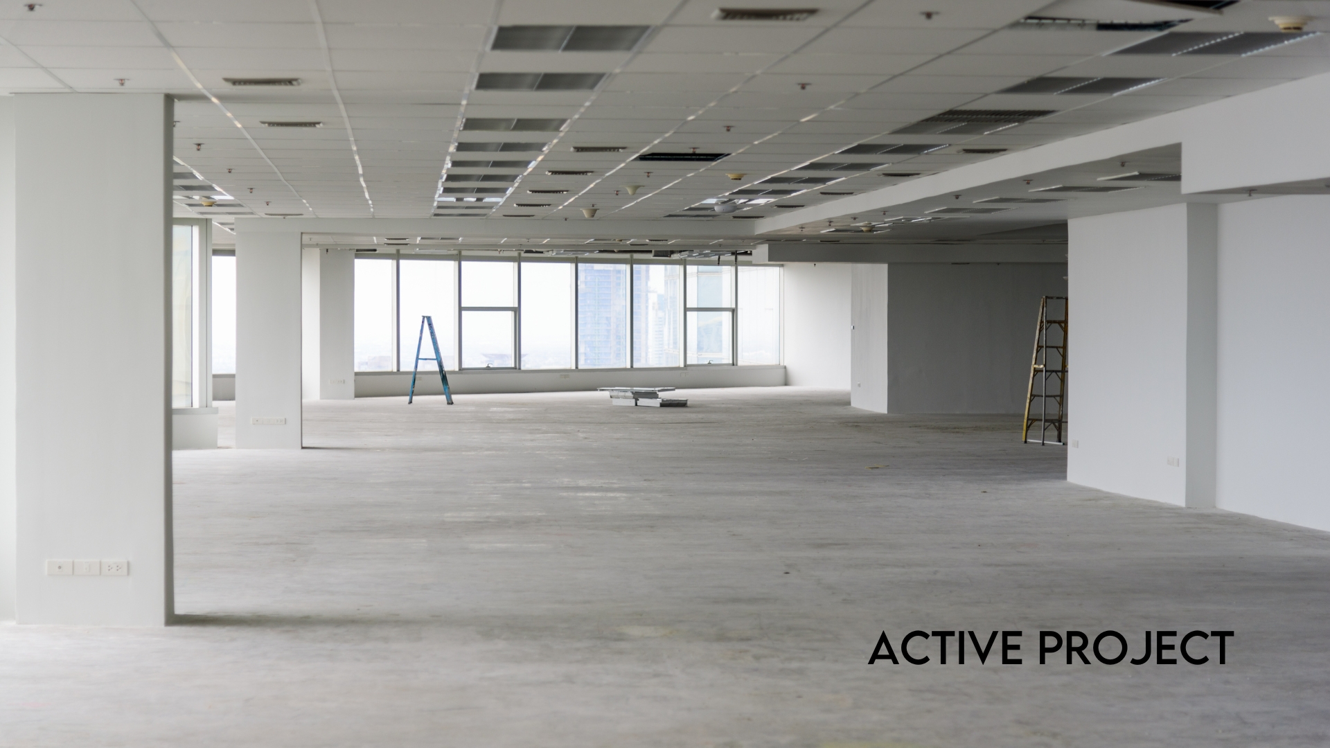 Two-story office interior with specialty finishes at NAI Merin Hunter Codman, Fort Lauderdale