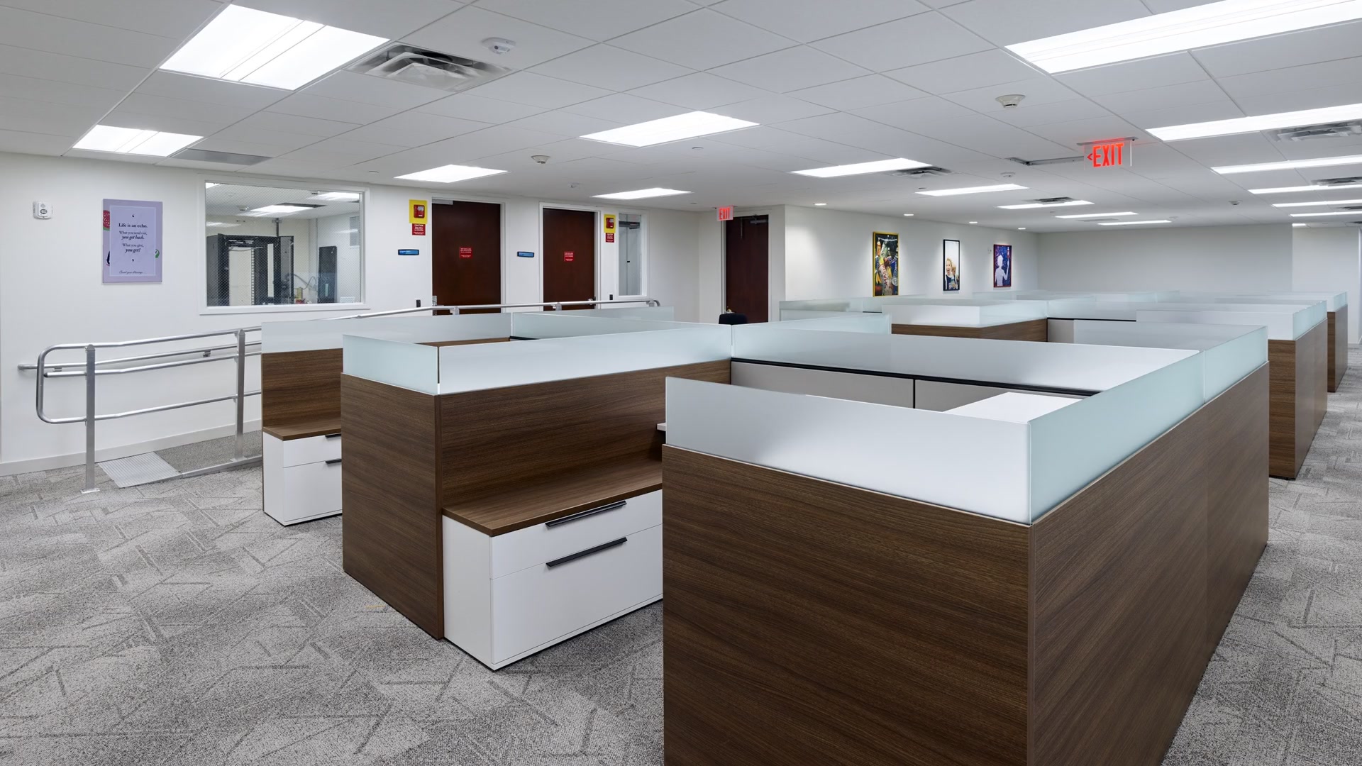 Corporate headquarters workspace with demountable partitions and suspended linear lighting in Doral, Florida